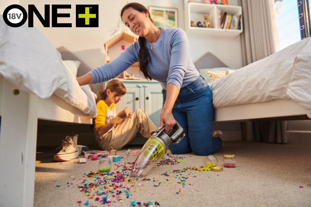 Woman vacuuming up with Slimline Vac